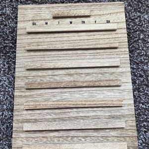 Wood calendar with numbers, letters, and months